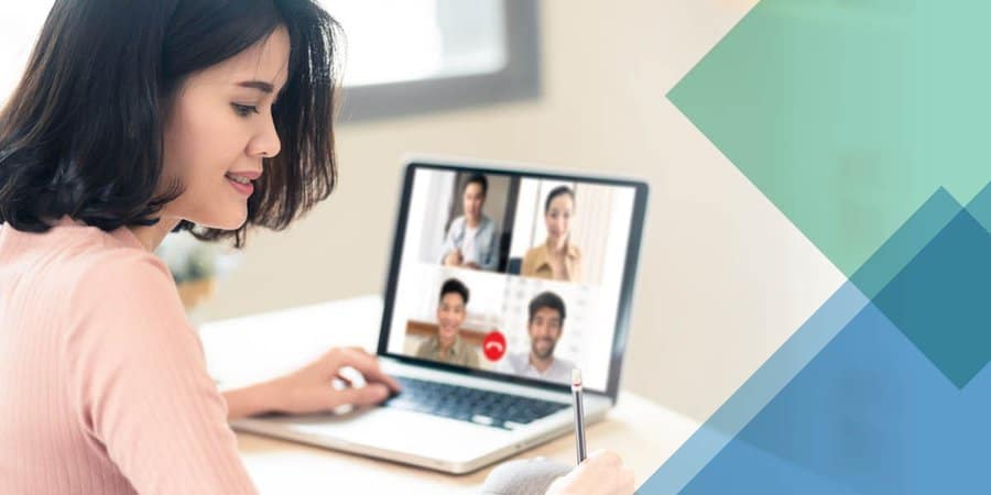 Women attending virtual meeting on laptop