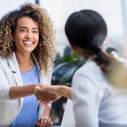 women shaking hands