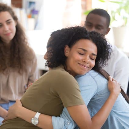 women giving a hug