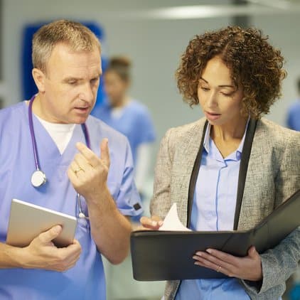 Doctor working with hospital administrator