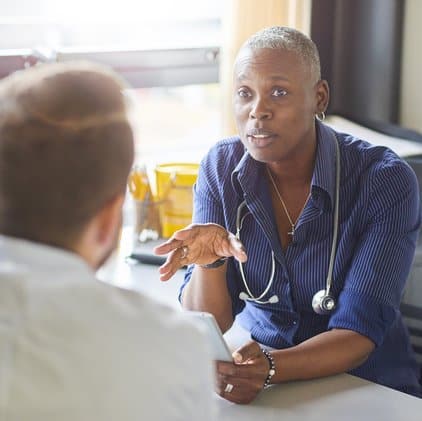 Doctor speaking to patient