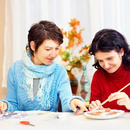 two women painting 