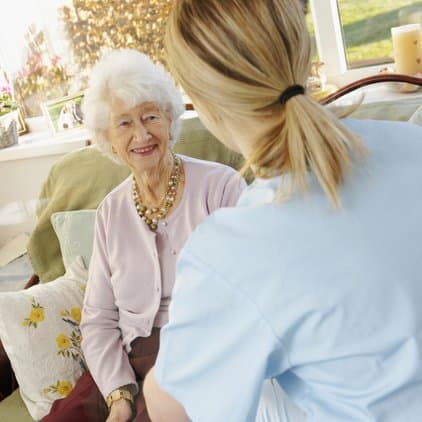 Female doctor and elderly patient