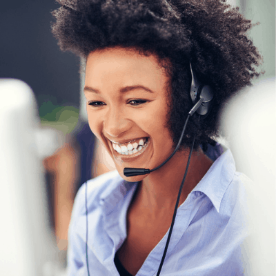 woman smiling while on the phone