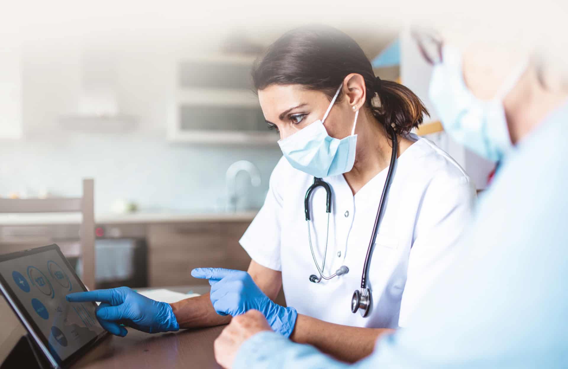 nurse looking at computer